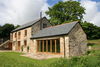 View of rear of barn with sitting room in the foreground